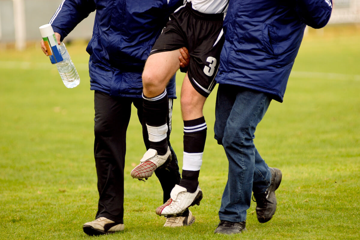 Soccer player gets injured and carried off soccer field